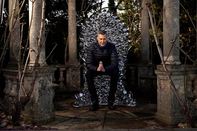 Uri Geller sitting on his Throne of Spoons to promote the Kellogg's big breakfast